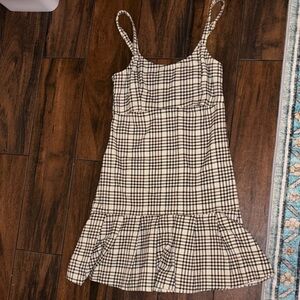 Hollister cream color dress with brown and black Plaid pattern.